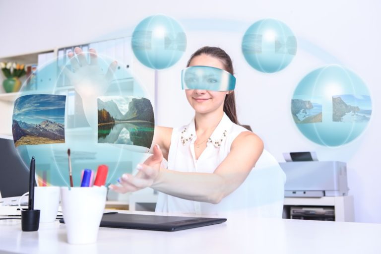 Woman at desk with bubbles of things she envisions