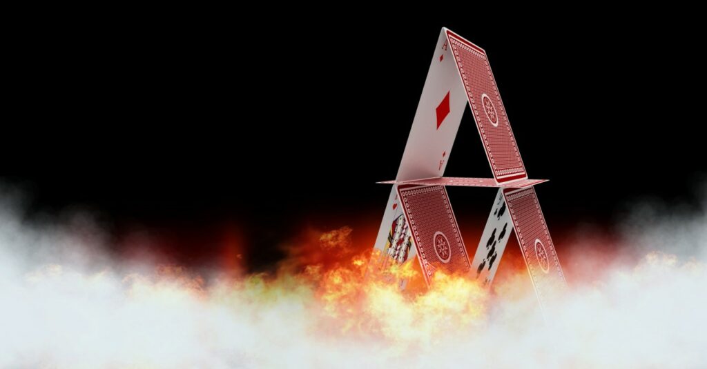 Will the Stock Market Burn Down the Real Economy? burning house of cards