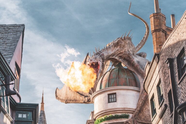 Photo of a dragon breathing fire over old buildings from Universal Studios lot